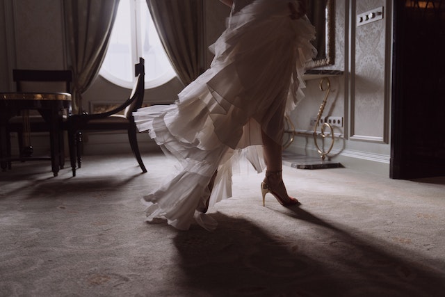 person-in-white-dress-running