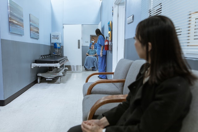 nurse-pushing-a-patient-on-a-wheelchair