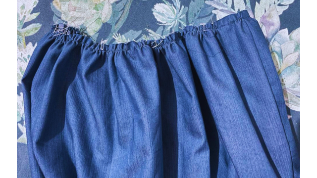 Create a gathered edge at the top of the skirt