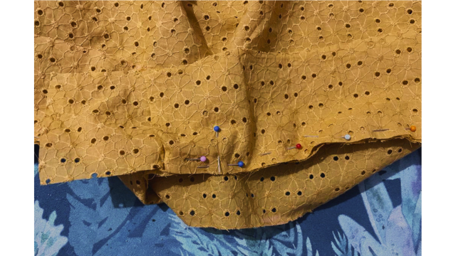 Pin the waistband in place on the gathered dress